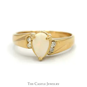 Pear Cut Opal ring with Diamond Accented Sides in 14k Yellow Gold